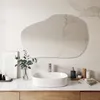 A modern bathroom vanity with a sink, faucet, mirror, and accessories. Produktbild-Vorschau