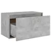 A concrete-effect wooden storage unit with one drawer partially open, shown against a white background. Produktbild-Vorschau