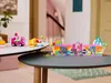 LEGO® DreamWorks 10797 Gabbys Partyraum set displayed on two tables in a home setting. Produktbild-Vorschau