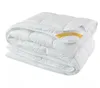 A folded white duvet is shown against a white background. Podgląd zdjęcia produktu