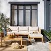 An outdoor patio scene featuring a sectional sofa and coffee table. Produktbild-Vorschau