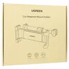 The image shows the packaging of a car headrest mount holder for smartphones and tablets. Náhled obrázku produktu