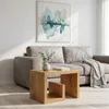 A living room scene with a couch and a coffee table. Produktbild-Vorschau