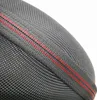 A close-up view of the textured fabric of a headphone case, showing red stitching. Produktbild-Vorschau