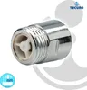 A close-up product shot of a chrome plumbing fitting with a white internal component, set against a white and light gray background with graphic elements. Produktbild-Vorschau
