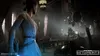 A female character in a white dress stands in a dimly lit room, holding a blue lightsaber. In the background, stormtroopers are visible. Produktbild-Vorschau