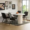 A dining room setting with a table and chairs. Produktbild-Vorschau