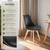 A black dining chair with wooden legs is shown next to a small wooden table, with curtains in the background. A panel on the left details the chair's features. Náhled obrázku produktu