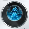 A close-up of a washing machine drum with a neon blue graphic of a jacket and mountains inside. Produktbild-Vorschau