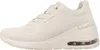 A side view of a beige Skechers sneaker. Produktbild-Vorschau