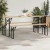 An outdoor patio setting with a wooden picnic table and benches, surrounded by plants. Podgląd zdjęcia produktu