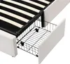 A close-up view of the underside of a bed frame, showing a pull-out storage drawer. Produktbild-Vorschau