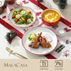 Auf dem Weihnachtstisch sind Teller und Schalen aufgestellt. Voir les images du produit