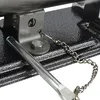 A close-up view of a metal bracket and chain attached to a textured surface. Náhled obrázku produktu
