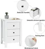 A white wooden nightstand with three drawers is shown with callouts highlighting its features. Podgląd zdjęcia produktu