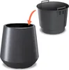 A dark gray planter and a dark gray insert are shown against a white background, with an orange arrow indicating the insert fits into the planter. Voir les images du produit