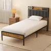 A single bed with a white mattress and a dark gray headboard is shown in a bedroom setting. Náhľad obrázku produktu