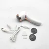 A white electric callus remover with accessories laid out on a white and gray speckled surface. Produktbild-Vorschau
