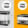 Collage showing two views of a food dehydrator with measurements indicating tray height. Anteprima dell’immagine prodotto