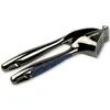 A close-up studio shot of a garlic press. Podgląd zdjęcia produktu