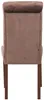 The back view of a brown velvet dining chair with a tufted back and wooden legs, isolated on a white background. Voir les images du produit