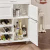 A white kitchen cart filled with bottles of wine and spirits, along with glassware and an ice bucket. Produktbild-Vorschau