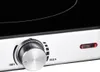 A close-up view of a control knob and indicator light on a stovetop. Anteprima dell’immagine prodotto