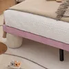 A close-up view of a bed with a pink upholstered base and a white mattress with small perforations. Náhled obrázku produktu