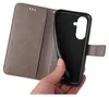 A hand is holding a grey flip phone case, showing the inside of the case where a phone would be placed. Produktbild-Vorschau