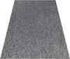 A close-up, angled view of a gray rug with a textured, linear pattern.