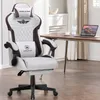 A gaming chair is placed in a home office setting next to a desk with a laptop. Náhled obrázku produktu