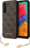 A phone case with a brown Guess logo pattern and gold charms is shown next to a smartphone. Podgląd zdjęcia produktu
