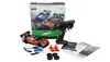 A remote-controlled drift racing car set with accessories, including a controller, spare tires, and traffic cones, laid out on a white background. A box with images of two cars is visible in the background. Náhľad obrázku produktu