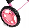A close-up of a pink and black doll stroller wheel. Produktbild-Vorschau