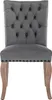 A single gray upholstered dining chair with tufted back and wooden legs is shown against a white background. Náhľad obrázku produktu