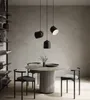 A dining set with pendant lights in a modern room. Voir les images du produit