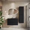 A modern bathroom vanity set with a black matte finish, featuring a sink, drawers, and a tall cabinet, set against a tiled wall. Produktbild-Vorschau