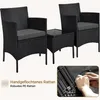 A black rattan garden furniture set with two chairs and a small table, shown on a white background with an inset image demonstrating the weaving process. Produktbild-Vorschau