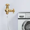 A brass faucet with two outlets is connected to a clear hose, and a washing machine is visible to the right. Podgląd zdjęcia produktu