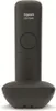 A black Gigaset CE575HX cordless phone handset is standing upright on its charging base. Podgląd zdjęcia produktu