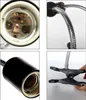 A collage of four close-up images showing different parts of a lamp with a clamp base. Voir les images du produit