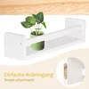 A white wooden wall shelf with a potted plant on it, and a close-up of the mounting hardware. Náhľad obrázku produktu