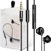 A product shot of earphones and their packaging. Podgląd zdjęcia produktu