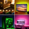 A collage of four images showing LED RGB light strips used in different settings: under a bed, behind a TV, inside a computer case, and behind a computer monitor. Náhľad obrázku produktu