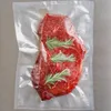 A vacuum-sealed package containing a raw steak with rosemary sprigs. Produktbild-Vorschau