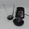A disassembled blender with its base, glass jar, and lid shown against a white background. Voir les images du produit