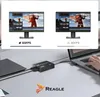 A capture card connected to a laptop, with two monitors displaying video editing software at different frame rates. Náhled obrázku produktu