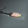 A close-up of an HDMI cable connector with light streaks emanating from it, suggesting high speed data transfer. Anteprima dell’immagine prodotto