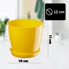 A yellow plastic plant pot with a saucer, shown with measurement indicators. Podgląd zdjęcia produktu