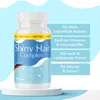 A bottle of Shiny Hair Complex supplements is displayed on a white pedestal against a light blue background with promotional text on the right. Produktbild-Vorschau